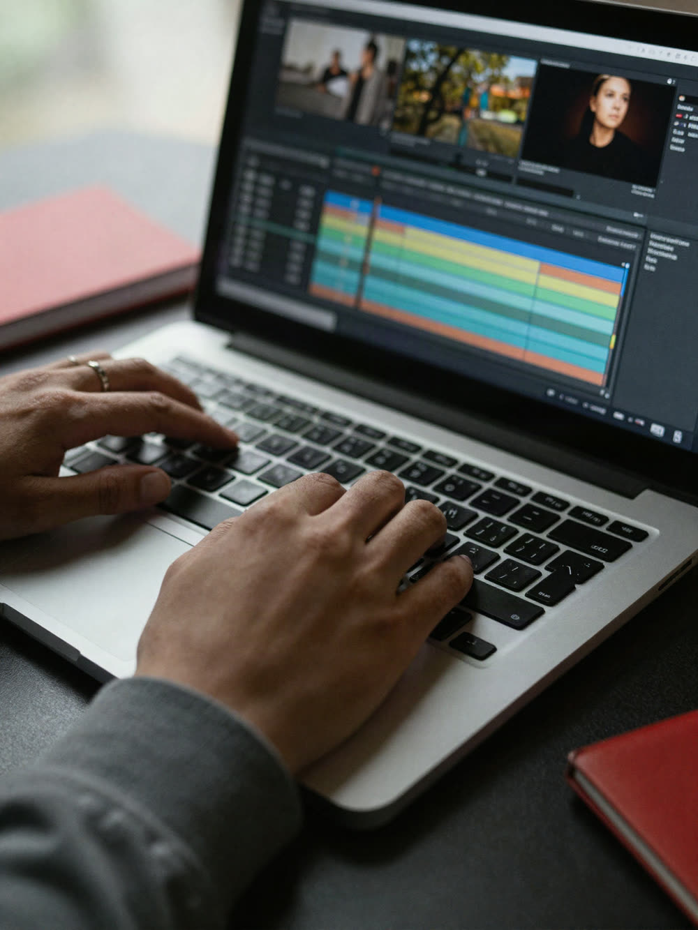 Hands typing on a laptop